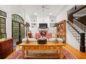 Bright living room boasting large windows, built-in bookshelves, a fireplace, and hardwood floors throughout at 4470 Crestwicke Pointe, Atlanta, GA 30319
