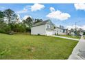 Two-story home on a large lot with a grassy front yard and long driveway at 74 Macland Mill Ln, Dallas, GA 30157