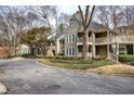 Apartment complex exterior featuring multiple units with balconies, surrounded by trees at 505 Bainbridge Dr, Atlanta, GA 30327