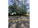 Street view of the vacant lot showing the available space and neighborhood setting at 120 Woodlawn Drive, Marietta, GA 30067