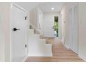 Inviting foyer with hardwood floors and a staircase leading to the upper level at 3326 Northcrest Rd # C, Atlanta, GA 30340