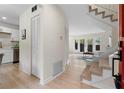 Bright entryway with hardwood floors, leading to the living area and staircase at 3326 Northcrest Rd # C, Atlanta, GA 30340