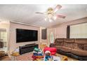 Cozy living room features hardwood floors, neutral walls, and a comfortable seating area at 365 Falling Timber Ct, Stockbridge, GA 30281