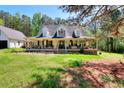 Beautiful two-story home with a classic covered porch, perfect for relaxing outdoors at 377 Lakeview Dr, Newborn, GA 30056