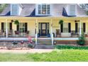 Inviting front porch adorned with rocking chairs and charming decorative accents at 377 Lakeview Dr, Newborn, GA 30056