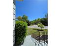 View from the front porch, showing the meticulously maintained front yard and the peaceful neighborhood setting at 760 Whitehall Way, Roswell, GA 30076