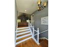 Inviting foyer boasting hardwood floors and staircase leading to the main living area at 760 Whitehall Way, Roswell, GA 30076