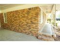 Brick exterior of home featuring a covered walkway, neutral trim, and multiple windows at 811 Verde Dr, Riverdale, GA 30274