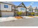 Charming townhomes featuring brick and siding exteriors, complemented by well-maintained landscaping at 605 Stone Field Nw Run, Marietta, GA 30060