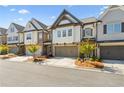 Charming townhomes featuring brick and siding exteriors, complemented by well-maintained landscaping at 605 Stone Field Nw Run, Marietta, GA 30060