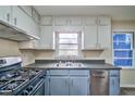 Cozy kitchen with stainless steel appliances and ample cabinet space for convenient storage at 933 Dell Se Ave, Smyrna, GA 30080