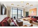 Bright and airy living room featuring contemporary decor, large windows and comfortable seating at 2233 Peachtree Ne Rd # 1207, Atlanta, GA 30309
