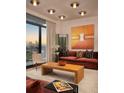 Cozy living room with stylish decor, modern artwork, and floor-to-ceiling windows showcasing a city view at 2233 Peachtree Ne Rd # 1207, Atlanta, GA 30309