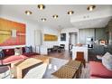 Stylish living room with open concept kitchen and dining area, creating an inviting space at 2233 Peachtree Ne Rd # 1207, Atlanta, GA 30309