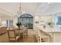 Expansive kitchen with an island, bar seating, a dining table, and an outdoor view at 2562 Red Valley Rd, Atlanta, GA 30305