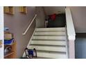 View of a staircase leading to the upper level of the home at 4175 Round Stone Dr, Snellville, GA 30039