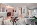 Bright and airy living room featuring wood floors, gray walls and modern furnishings at 2700 Pine Tree Ne Rd # 4003, Atlanta, GA 30324