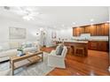 Spacious living room with hardwood floors seamlessly connects to the dining and kitchen areas at 503 Madison Se Ct, Smyrna, GA 30080