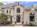 Stately home featuring decorative windows and a welcoming double-door front entrance at 960 Tiverton Ln, Alpharetta, GA 30022
