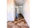 Hallway with tiled floors and a door leading to a closet or pantry at 2089 Belmont Cir, Conyers, GA 30012