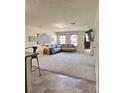 Open-concept living room with a comfortable seating area, natural light and TV at 2089 Belmont Cir, Conyers, GA 30012