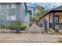 Exterior view of charming apartment building with fenced yard and beautiful landscaping at 210 Sampson Ne St # 8, Atlanta, GA 30312