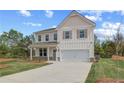 Beautiful two-story home with a two-car garage and an expansive lawn at 576 Teversham Dr, Mcdonough, GA 30253
