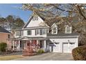 Charming two-story home with beautiful landscaping and a three-car garage offers curb appeal at 6236 Benbrooke Nw Dr, Acworth, GA 30101