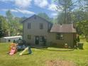 Spacious backyard with patio area, ideal for entertaining and enjoying the outdoors at 1500 Country Ct, Auburn, GA 30011
