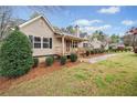 Side view of a cozy home featuring manicured bushes, offering a serene and welcoming atmosphere at 162 Brookhaven Way, Rockmart, GA 30153