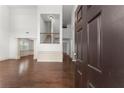 Bright entryway with gleaming hardwood floors, wainscoting, and a view of the staircase at 550 Eldridge Dr, Suwanee, GA 30024