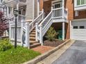 Elevated entryway featuring white railings and a one car garage at 7 Nesbit Pl, Alpharetta, GA 30022