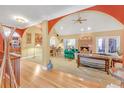 Spacious living room with a brick fireplace and views of the back yard at 20 Balfour Dr, Covington, GA 30014