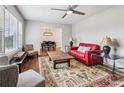 Bright living room with large window, a ceiling fan, hardwood floors, and stylish furniture at 2265 Starline Dr, Decatur, GA 30032