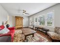 Bright living room featuring hardwood floors, stylish furniture, and natural light from the large windows at 2265 Starline Dr, Decatur, GA 30032