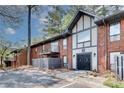 Charming townhome with brick facade, private balconies, and manicured landscaping in a desirable neighborhood at 6851 Roswell Rd # A21, Sandy Springs, GA 30328