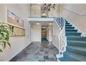 Elegant building lobby with a staircase, mailboxes, bulletin board, and tile flooring at 6851 Roswell Rd # A21, Sandy Springs, GA 30328