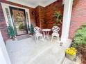 Inviting front porch with decorative chairs and a welcoming wreath on the front door at 1412 Brighton Pl, Loganville, GA 30052