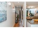 Hallway with view of stairs and contemporary decor leading to a modern kitchen at 1253 Caroline Ne St # 229, Atlanta, GA 30307
