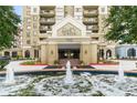 Upscale condo entrance with fountains and manicured landscaping at Park Towers at 795 Hammond Dr # 806, Sandy Springs, GA 30328