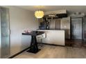 A modern kitchenette features sleek countertops, modern appliances and a breakfast bar at 795 Hammond Dr # 806, Sandy Springs, GA 30328