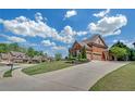 Lovely brick home with an extra-long driveway and beautiful landscaping at 866 Coopers Ridge Sw Path, Grayson, GA 30017