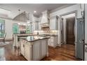 Gourmet kitchen with custom cabinets, granite countertops, and stainless steel appliances at 3574 N Druid Hills Rd, Decatur, GA 30033