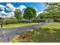 Traditional brick ranch with an expansive front yard and mature shade trees at 241 Burke Cir, Mcdonough, GA 30253