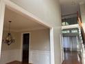 Open floor plan with hardwood floors, a staircase, and ample natural light at 3270 Moon Beam Ct, Snellville, GA 30039