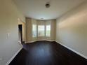 Bright living room featuring a bay window offering plenty of natural light and hardwood floors at 4500 Nocohoma Bnd, Douglasville, GA 30135