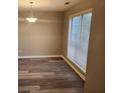 Cozy living room featuring new luxury vinyl plank flooring, neutral paint and a large window at 263 Northwind Dr, Stockbridge, GA 30281