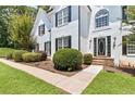 A well-maintained home with a lush green lawn and mature landscaping at 3183 Robinwood Trl, Decatur, GA 30034