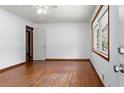 Bright living room featuring hardwood floors and natural light from a large window at 2307 Woodridge Dr, Marietta, GA 30066