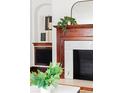 Close up of the fireplace with a stylish mirror and plant on the mantle at 479 Shannon Sw Dr, Atlanta, GA 30310